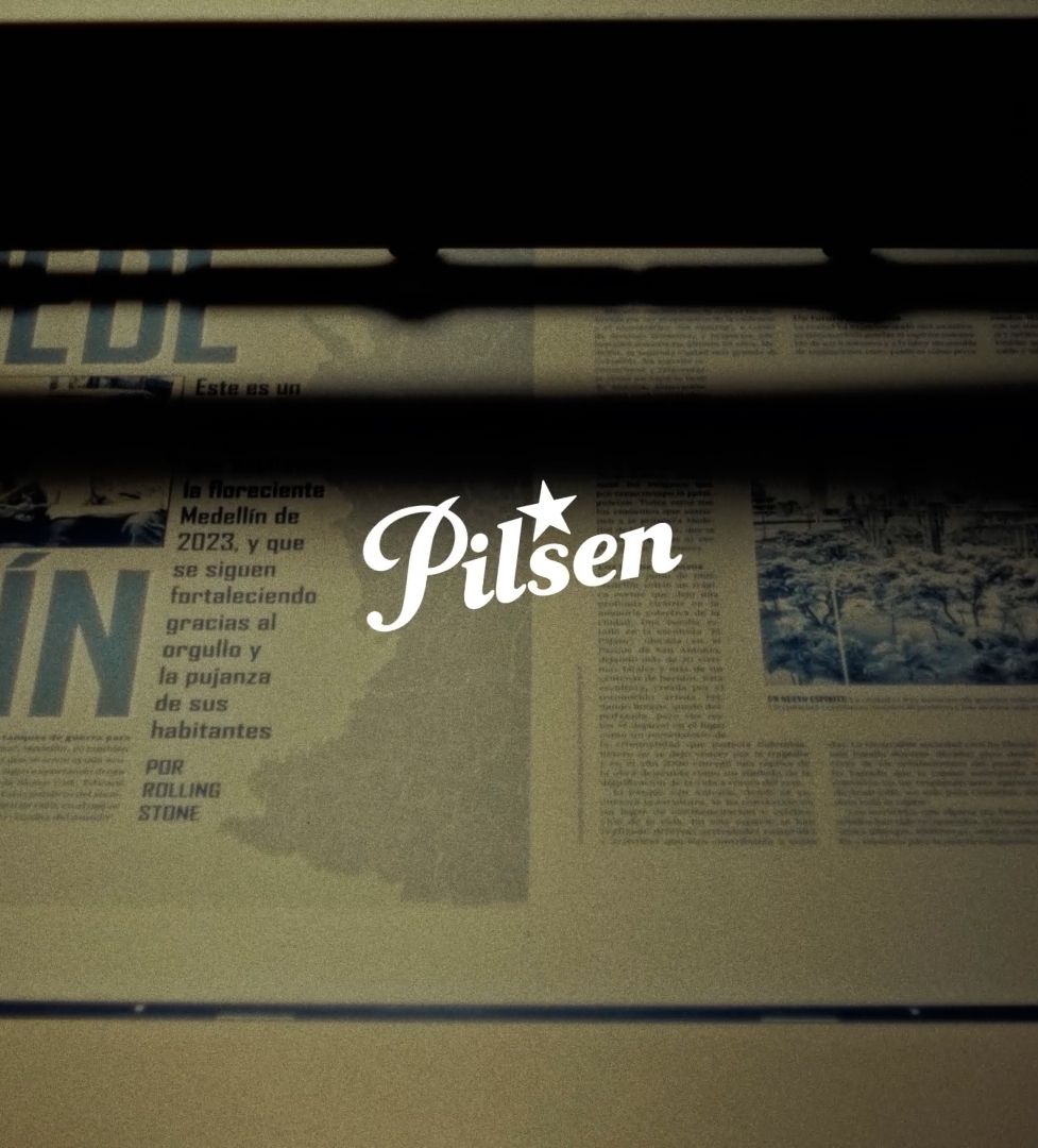 Pilsen Beer logo over a newspaper press