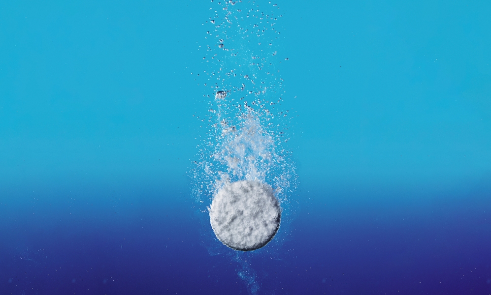 a pill being dropped in water