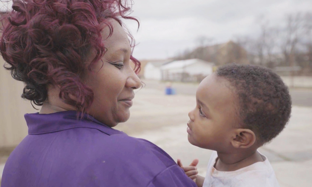 A woman holding a child