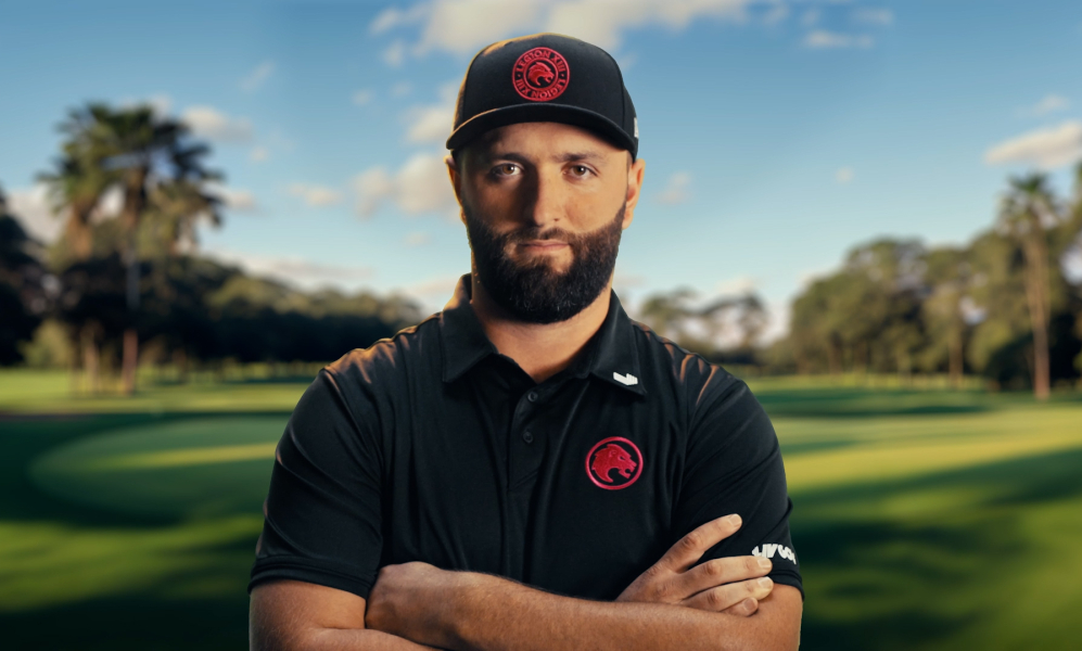 Jon Rahm standing on a golf course