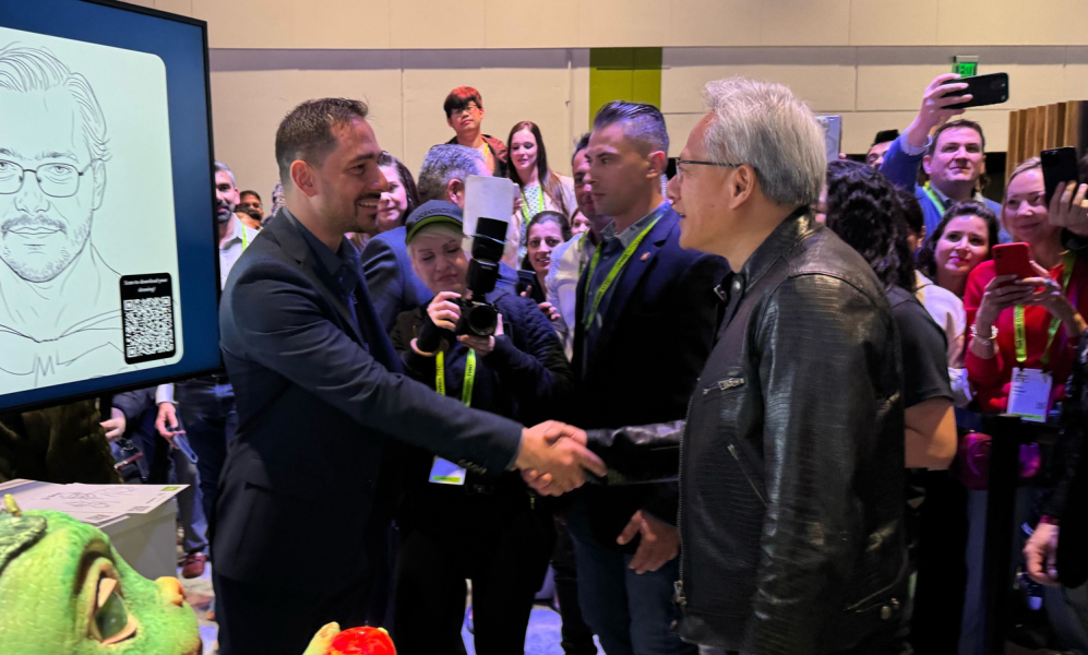 NVIDIA CEO Jensen Huang shaking hands with a presenter at GTC 2025