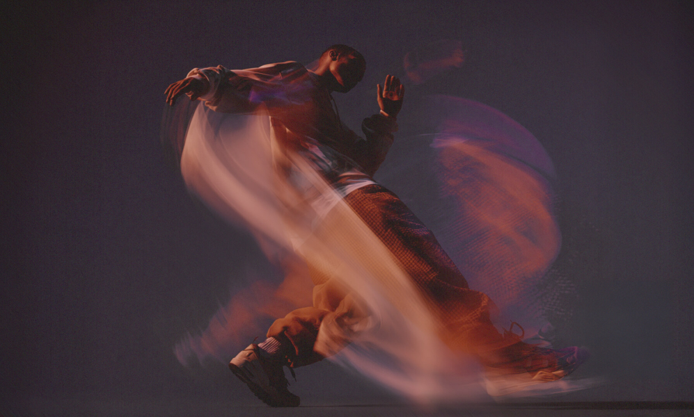 man dancing with swirls around