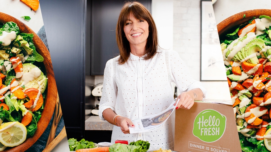 Woman in kitchen with Hello Fresh box