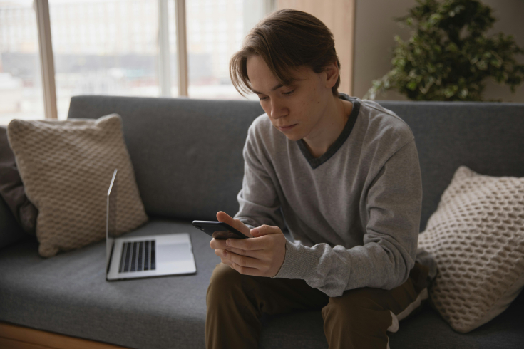 boy in his smartphone