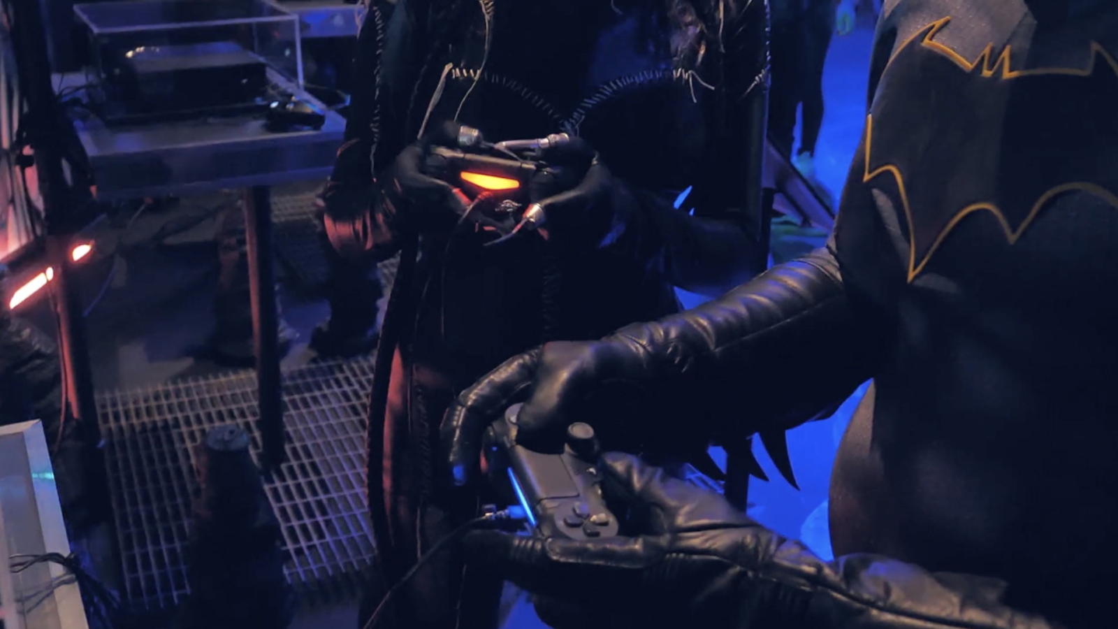 Batman characters playing with video controllers in the Batman Experience