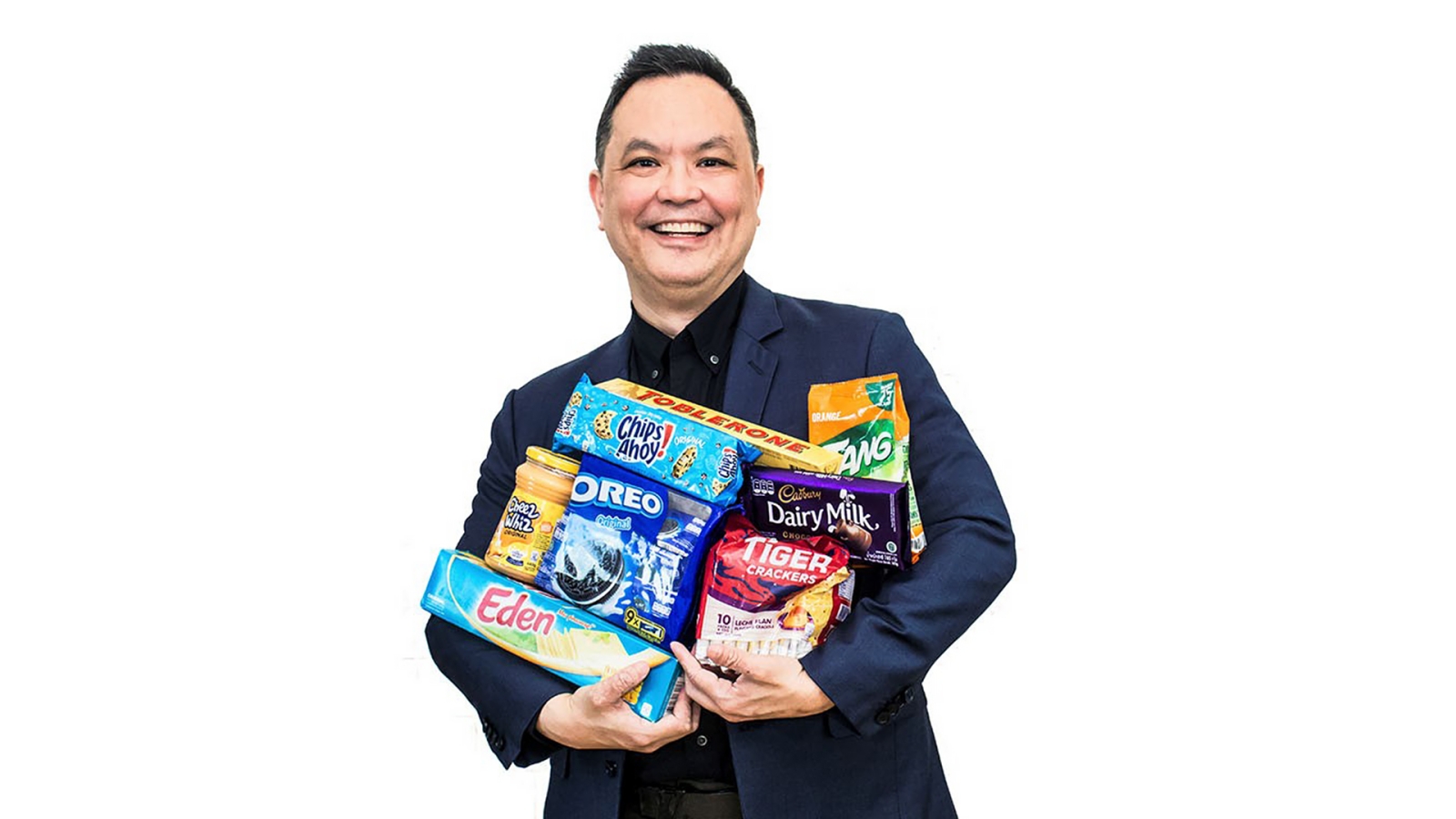 A person holding Mondelez snacks in arm