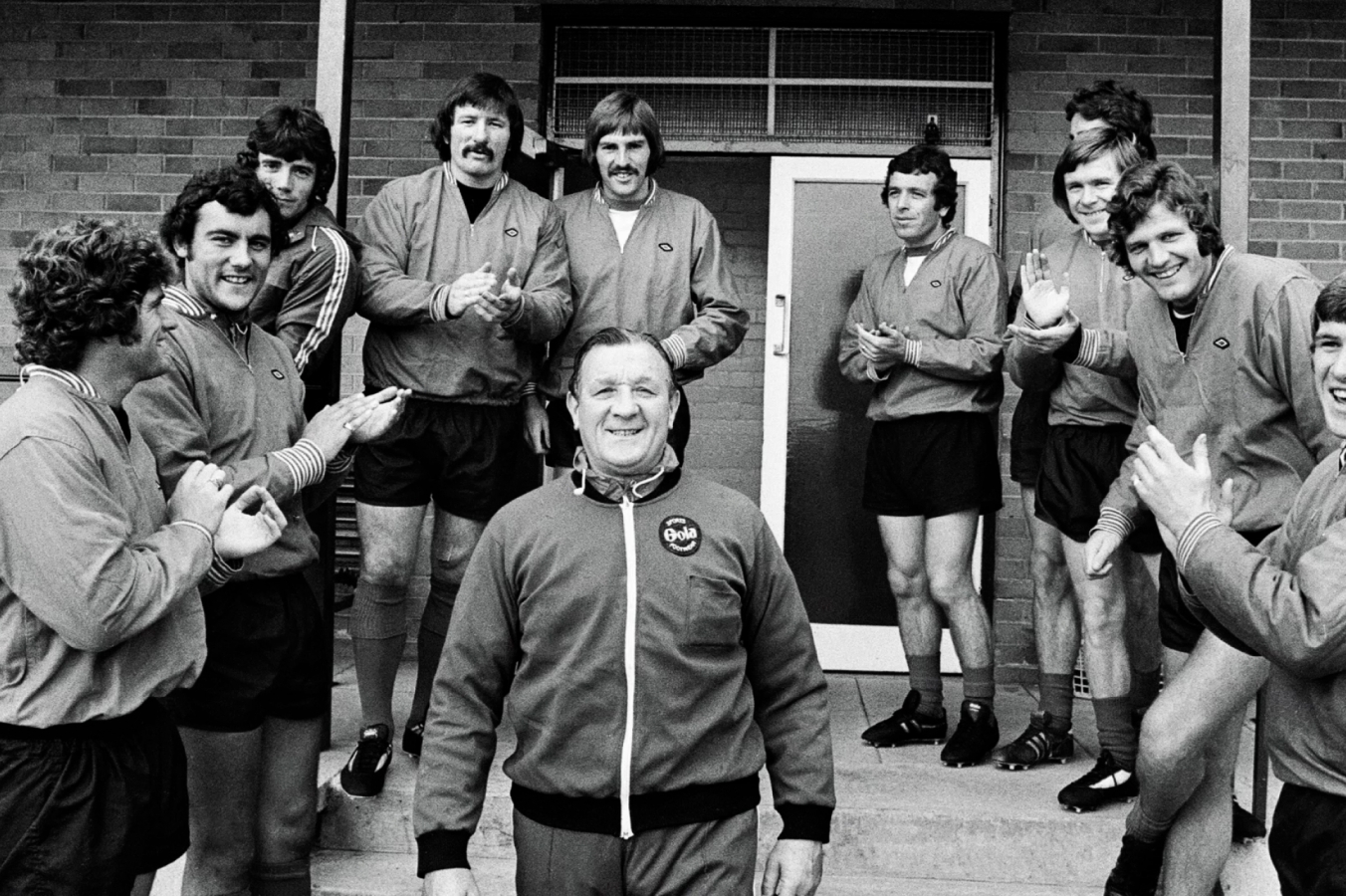 Bob surrounded by young team