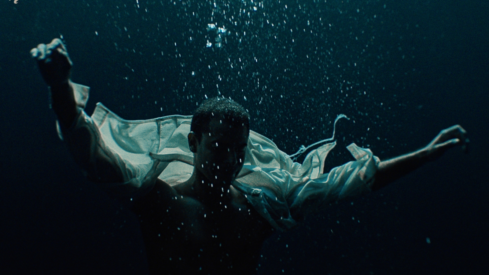 A person sinks in water