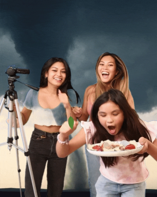 A group of girls running from a tornado while eating food