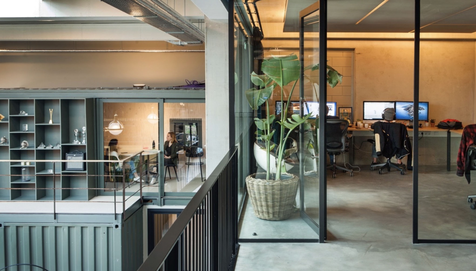 A building with a room of people editing videos