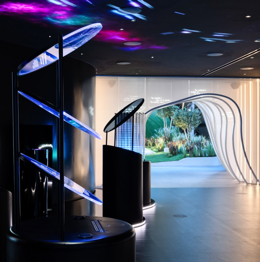 A dark room with colorful lights shining on the ceiling