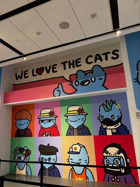 A mural showing different cool cats pieces of art