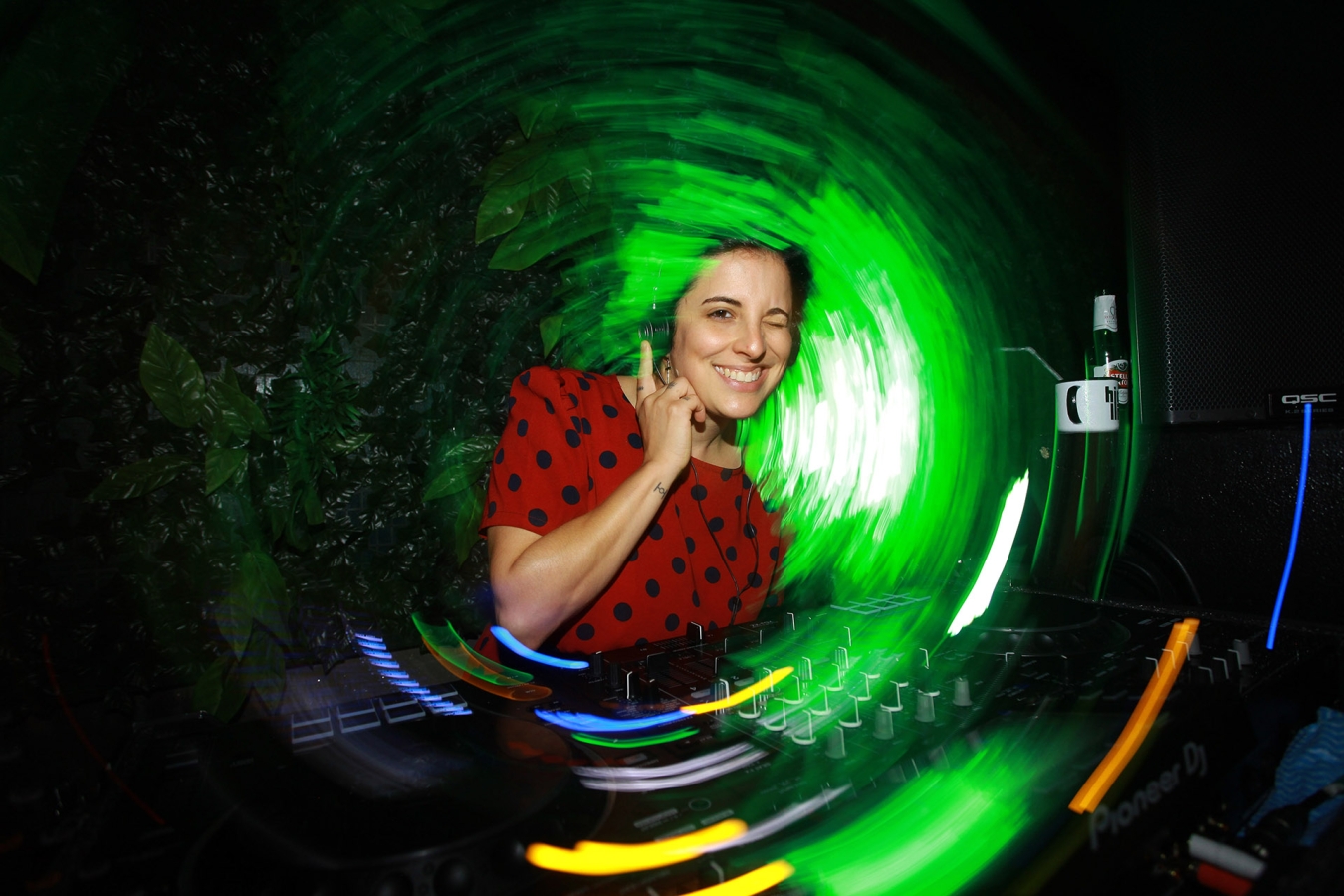 An employee djing at a party