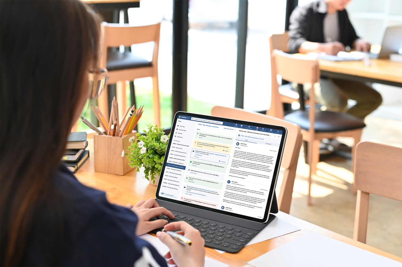 A person using the First American platform on a iPad
