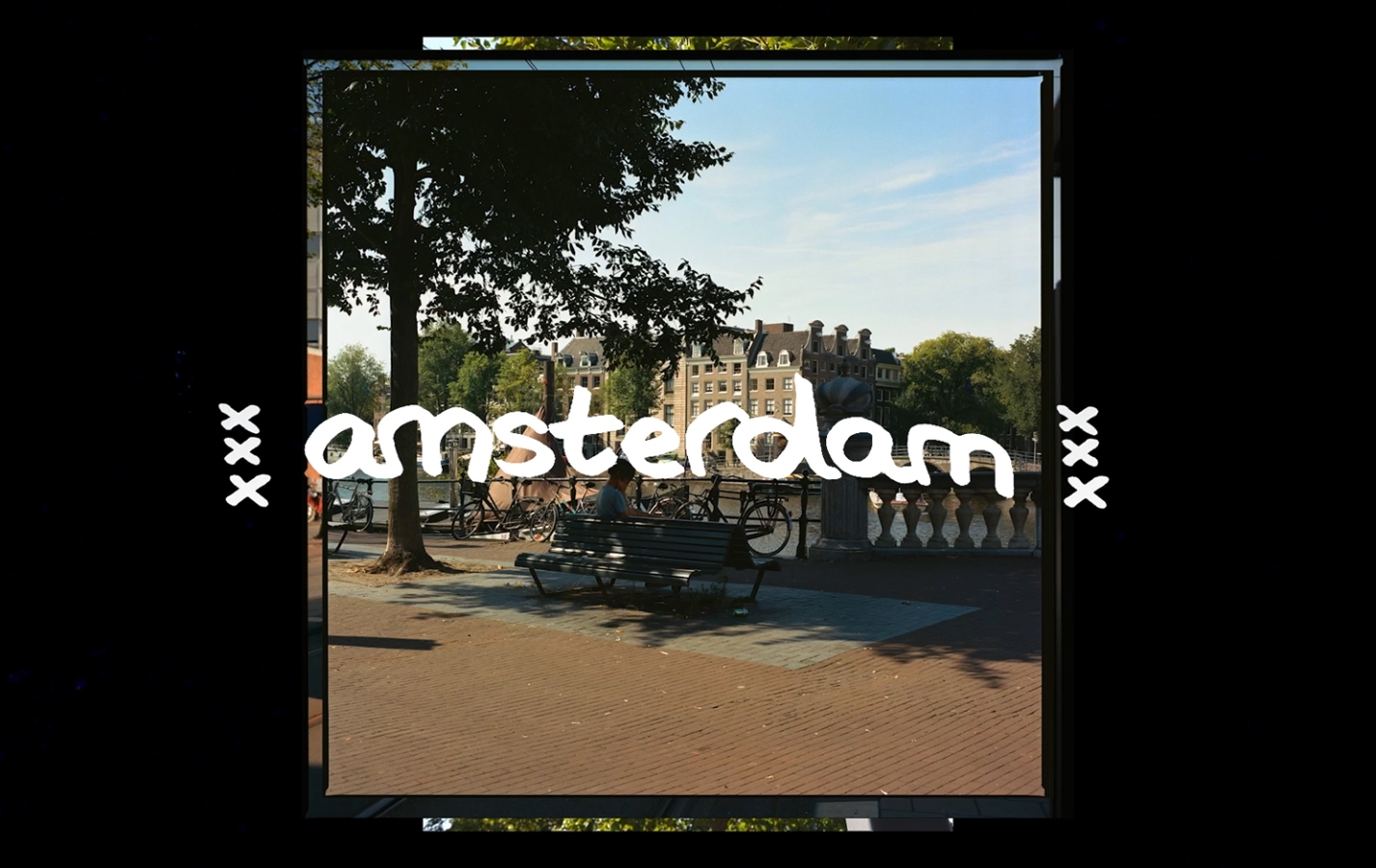 A photo of the calnals of Amsterdam by daylight. And on top of that in illustrated white letters the word Amsterdam.