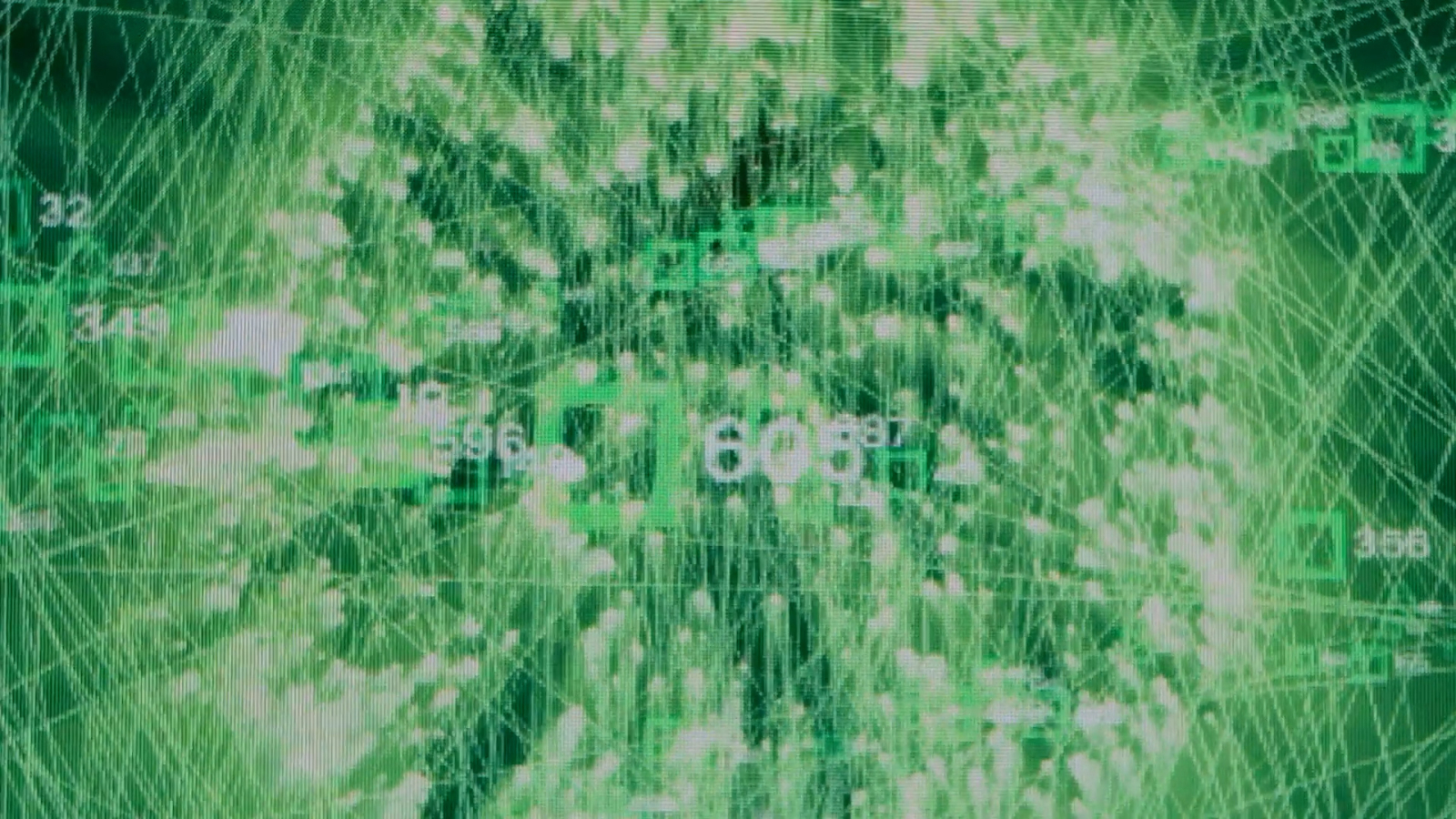 Green lines and letters and graphs all covered by each other on one screen.
