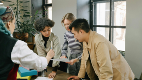 Employees working together around a table