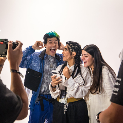 Experiential marketing event attendees are filmed interacting with a Google device, highlighting the creation of multi-modal content (video, social media, case study image) for a brand activation strategy.